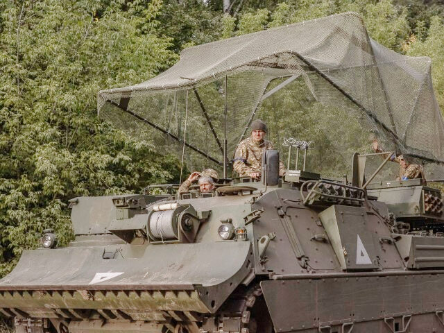 Ukrainian servicemen operate an armoured military vehicle in the Sumy region, near the bor