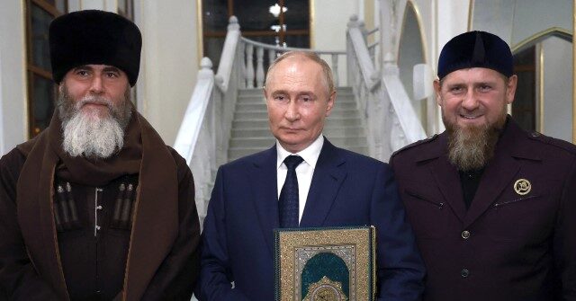 NextImg:Putin Visits Chechen Mosque, Kisses Golden Quran