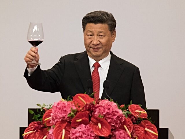 China's President Xi Jinping makes a toast during a banquet in Hong Kong on June 30, 2017.