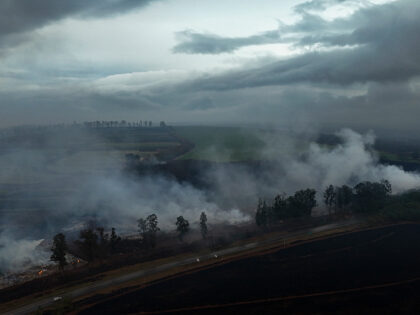 TOPSHOT - Aerial view shows a fire in the surroundings of the SP-253 highway in Ribeirao P