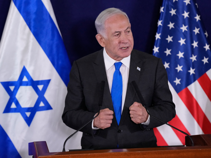 Israeli Prime Minister Benjamin Netanyahu gives statements to the media inside The Kirya,