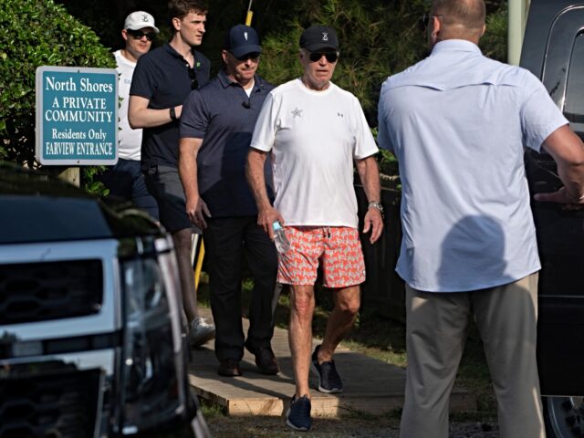 Secret Service agents provide security as US President Joe Biden walks to his vehicle afte