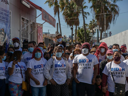 02 March 2021, Mexico, San Ysidro: "Biden, please let us in," reads in English o