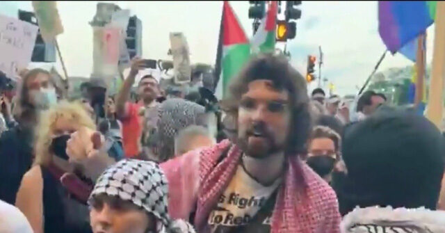 Leftist Protesters Chant 'Piggy, Piggy, Go Back Home' at Police Line