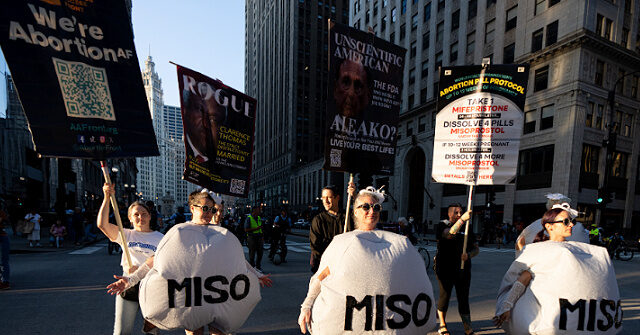 DNC Protesters March Through Chicago Streets Dressed as Abortion Pills