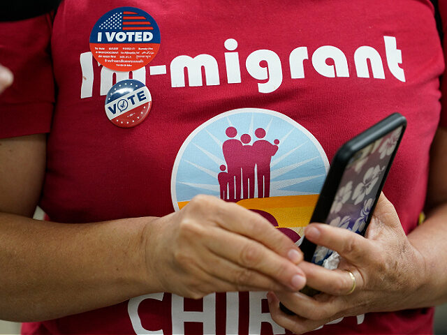 First time voter Betty Rodarte wears an "I voted sticker," after casting her ballot in-per