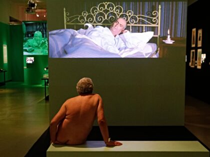 EDITORS NOTE: Graphic content / A visitor watches a film shown during a nudist visit of th