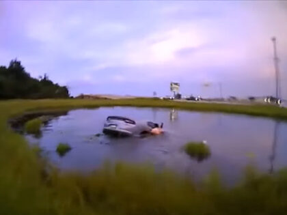 WATCH: 12-Year-Old, Officer, Good Samaritans Rescue Mom from Submerged Car