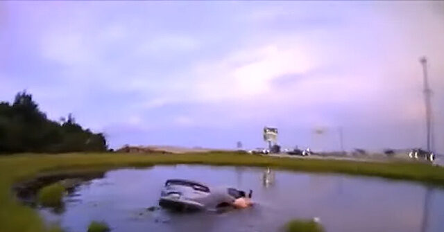 Watch: Child, Officer, Good Samaritans Rescue Mom from Submerged Car