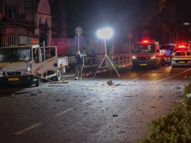 Israeli security and emergency personnel cordon off the site of an explosion in Tel Aviv o