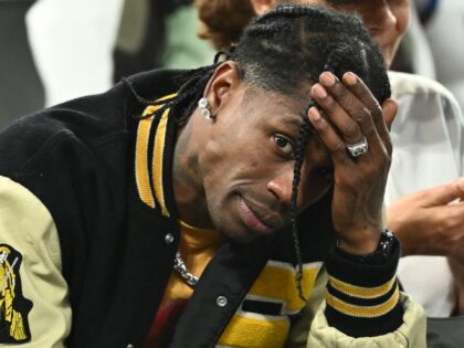 US rap artist Travis Scott gestures as he attends the men's semi-final basketball match be