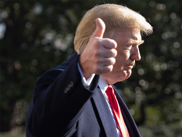 President Donald Trump gives a thumbs-up as he speaks to the press as he walks to Marine O