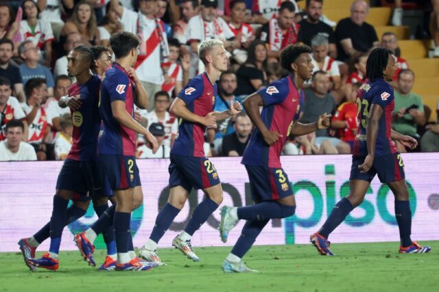 Barcelona's Spanish midfielder Dani Olmo (C) celebrates with teammates after scoring his t