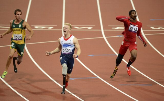 Britain's Jonnie Peacock (C) says he is now the hunter not the hunted and ready to regain