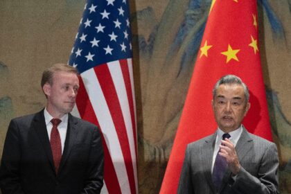 China's Foreign Minister Wang Yi (R) speaks as US National Security Advisor Jake Sullivan