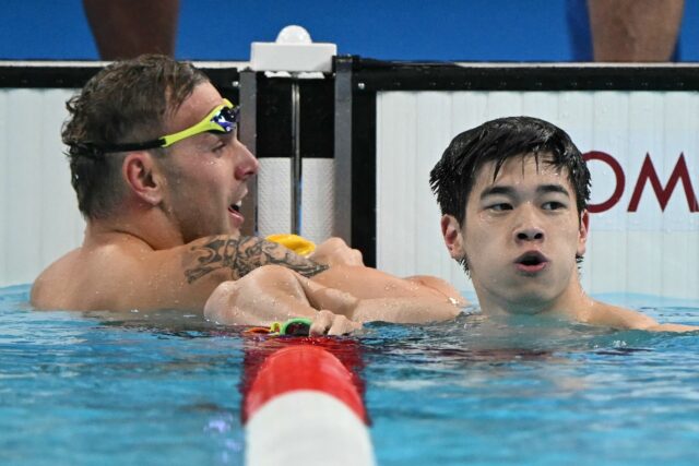 China's Pan Zhanle (R) celebrates next to Australia's Kyle Chalmers after breaking the 100