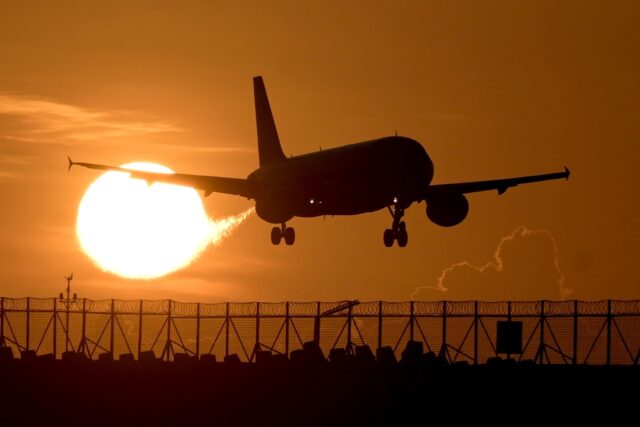 A commercial plane prepares to land at Ngurah Rai international airport in Denpasar, on In