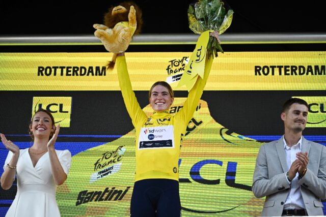 Demi Vollering (C) took over the yellow jersey after winning the stage-three time trial on