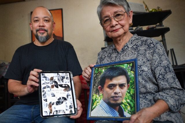 Edita Burgos (right), with her younger son and independent film director JL Burgos, holds