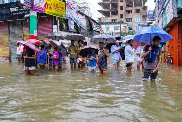 Floods triggered by torrential rains have swamped a swath of low-lying Bangladesh