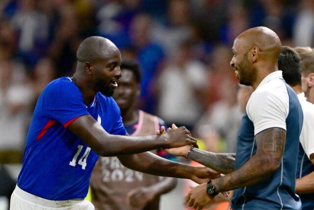 France coach Thierry Henry with top-scoring forward Jean-Philippe Mateta during the semi-f