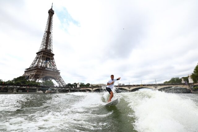 France's newly-crowned Olympic champion Kauli Vaast surfs along the Seine River