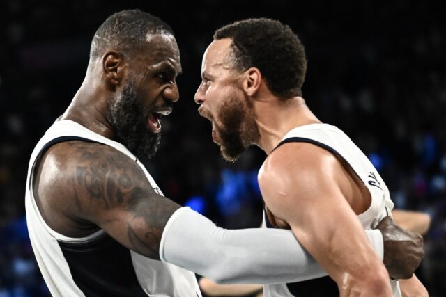 LeBron James celebrates with USA teammate Stephen Curry after a come from behind victory o