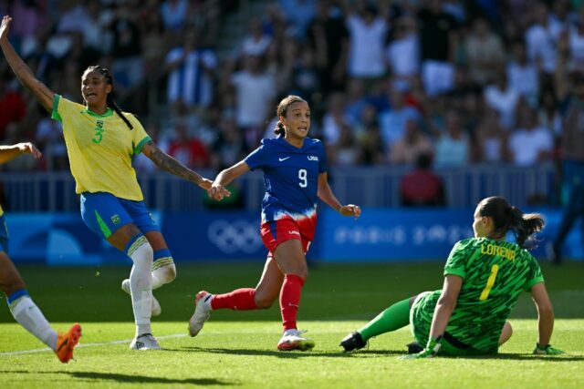 Mallory Swanson scores for the United States against Brazil in the Olympic women's footbal