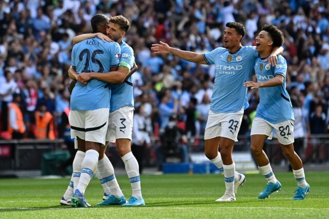 Manuel Akanji (left) scored the winning penalty as Manchester City beat Manchester United