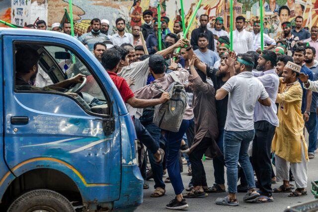 Mobs vowing to guard Bangladesh's student-led revolution roamed the site of a planned rall