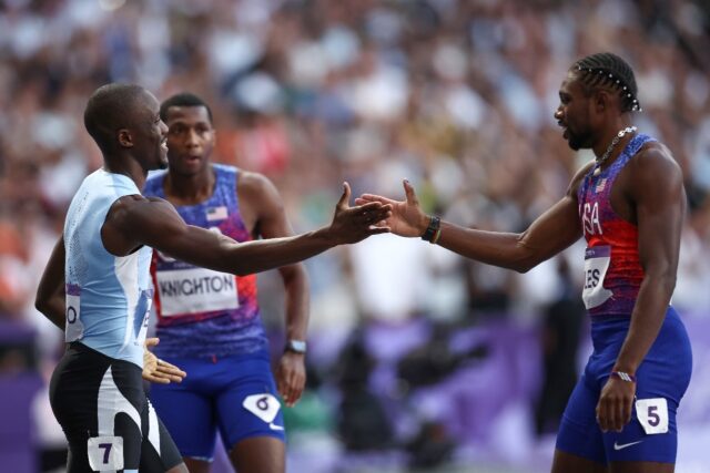 Noah Lyles congratulates Letsile Tebogo after the Botswanan denied him an Olympic sprint d