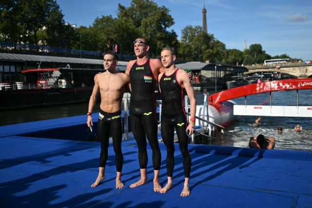 Olympic 10k marathon swimming winner Kristof Rasovszky (C) with silver and bronze medallis