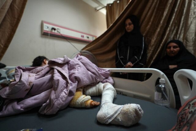 A Palestinian girl injured in Israeli bombardment in central Gaza receives care at the Al-