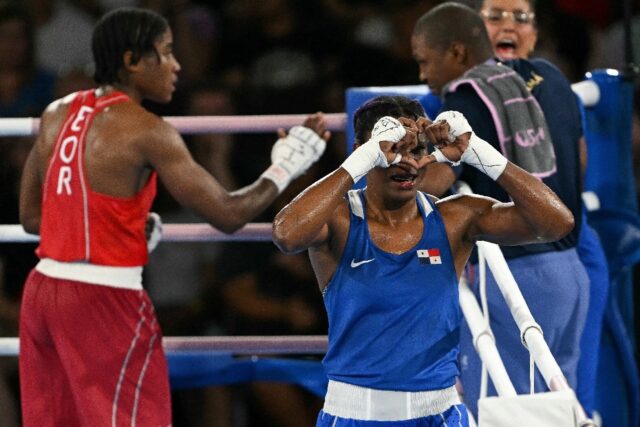 Panama's Atheyna Bylon (Blue) reacts after beating Refugee Olympic Team's Cindy Ngamba in