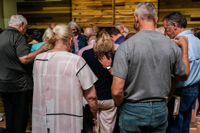 Parishioners pray at Clayton Baptist Church in the US state of Georgia, a key battleground