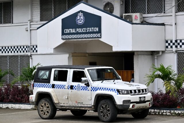 A police car, provided through the China Aid program, is seen in front of the Central Poli