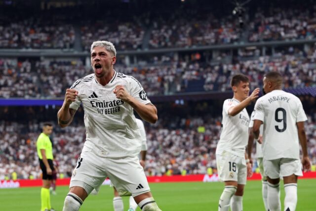 Real Madrid's Uruguayan midfielder Federico Valverde celebrates scoring the opening goal a