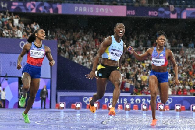 Saint Lucia's Julien Alfred roars with delight after winning the women's Olympic 100m fina