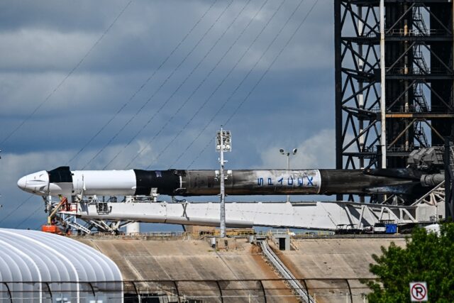 A SpaceX Falcon 9 rocket with the Crew Dragon Resilience capsule sits on Launch Complex 39