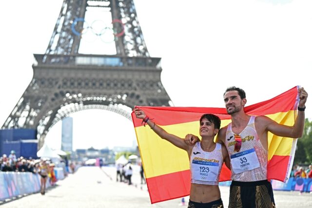 Spain's Maria Perez and Alvaro Martin pose after winning the mixed marathon race walk rela