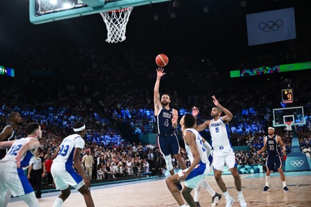 Stephen Curry takes a shot in the Olympic final between France and the USA in Paris