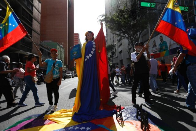 A supporter of Venezuelan President Nicolas Maduro protests in Caracas