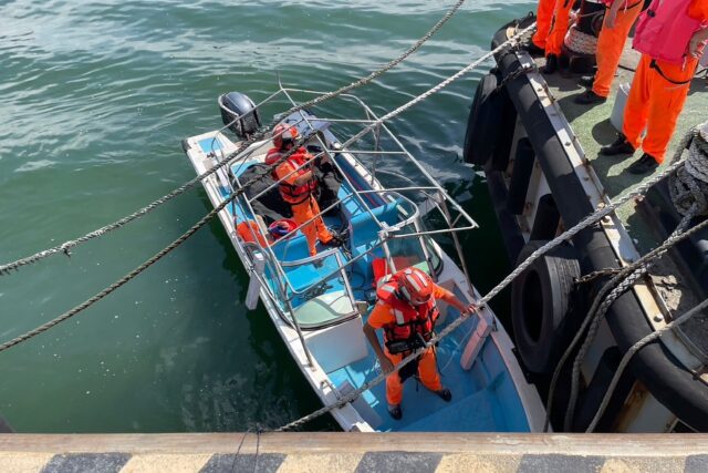 A Taiwan Coast Guard handout photo shows mariners seizing the boat Ruan used