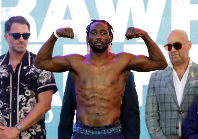 Terence Crawford, flexing his muscles at a pre-fight weigh-in, won the WBA super-welterwei