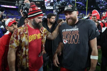 Travis Kelce celebrates the Kansas City Chiefs' win alongside his brother Jason Kelce in t