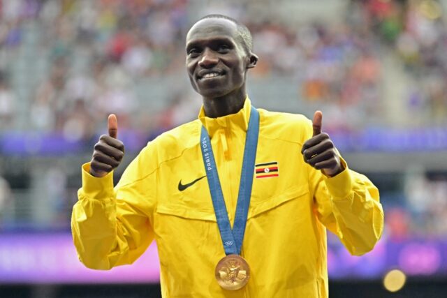 Uganda's Joshua Cheptegei poses after winning 10,000m gold in Paris