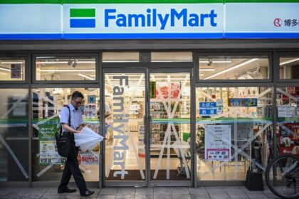 The windows of a convenience store in Fukuoka, Japan are taped up in anticipation of Typho