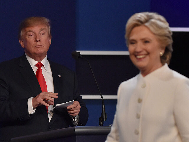 TOPSHOT - Democratic presidential nominee Hillary Clinton departs the stage following the