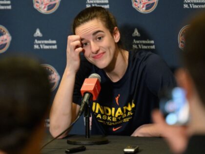 Indiana Fever guard #22 Caitlin Clark speaks during a press conference before a WNBA game