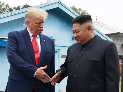 North Korean leader Kim Jong Un, right, and U.S. President Donald Trump prepare to shake h